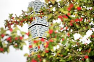Turning torso in Malmö with red flowers in foreground