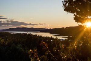 Forest, mountains and lake in the midnight sun in the north of Sweden