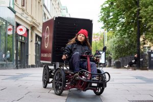 Person driving cargo bike in Gothenburg