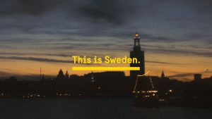 Stockholm city hall by night with "this is Sweden" text