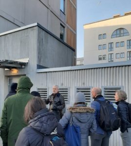 Erik Freudenthal demonstrating the Envac system for a group of people