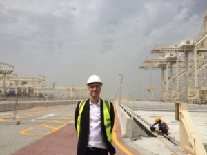 Prismalence's Marketing Manager Daniel Björk in front of construction