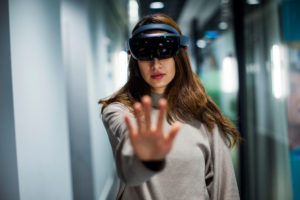 Women with VR head set with hand in front of her