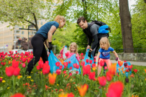 Family plogging - jogging and picking up litter