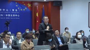 Man speaking in microphone on road show event