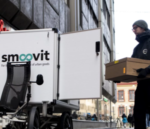 Man loading cargo bike with package
