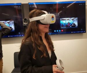 Woman with headset experiencing the VR tour
