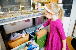 Girl recycling at home