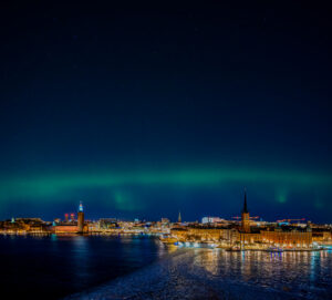 Northen lights over Stockholm siluette